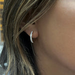 Load image into Gallery viewer, diamond hoop earrings in 14k yellow gold on model
