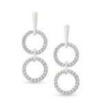 Load image into Gallery viewer, white gold dangling diamond earrings with two open circles connected by a metal bar on model. Unique jewelry, unique earrings. gladiator style earrings.
