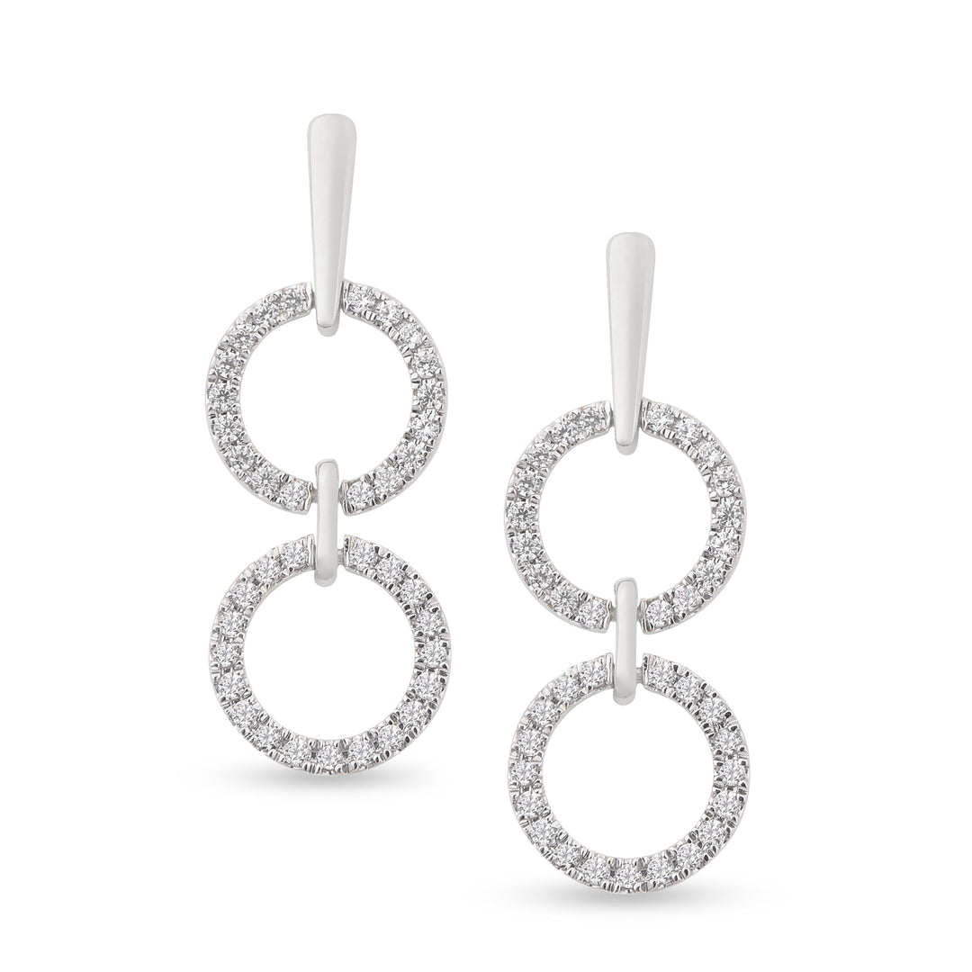 white gold dangling diamond earrings with two open circles connected by a metal bar on model. Unique jewelry, unique earrings. gladiator style earrings.