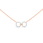 Load image into Gallery viewer, unique jewelry, unique necklace, fashion jewelry, fashion necklace, diamond necklace in rose gold, two circle shaped diamond motifs hanging horizontally connected in the middle by gold bar. Perfect for layering necklace.
