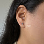 3/4ct diamond stud earrings in white gold on ear