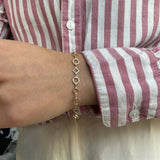 14k yellow gold geometric bracelet with alternating shapes and diamonds