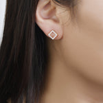 Load image into Gallery viewer, 14k yellow gold detachable diamond stud earrings on model