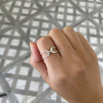 unique 14k yellow gold fashion ring with round and baguette diamonds on model