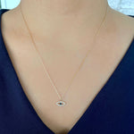 Load image into Gallery viewer, Diamond &amp; Blue Sapphire Evil Eye Pendant on model
