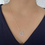 Load image into Gallery viewer, Diamond Baguette and Round Spiral Fashion Pendant in 14k yellow gold on model