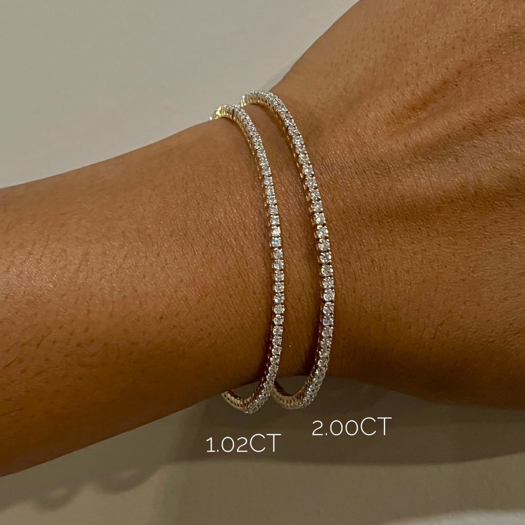 stackable diamond bracelets on model in 14k yellow gold side view