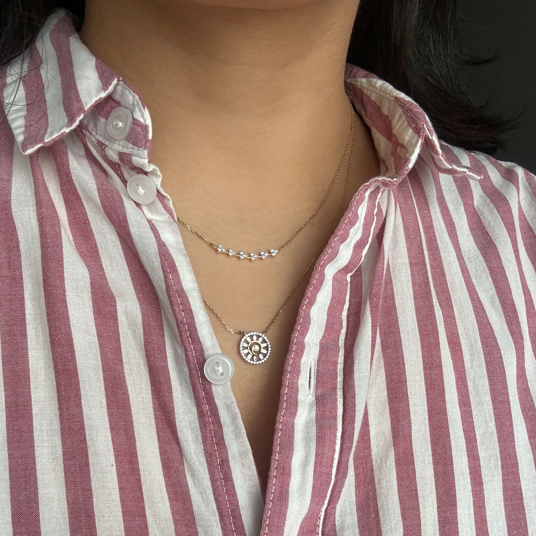 diamond cluster bar and spiral pendant with baguette diamonds in layering necklaces