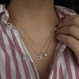 14k white gold layering necklaces with diamond and sapphire evil eye necklace and diamond in a bezel set necklace