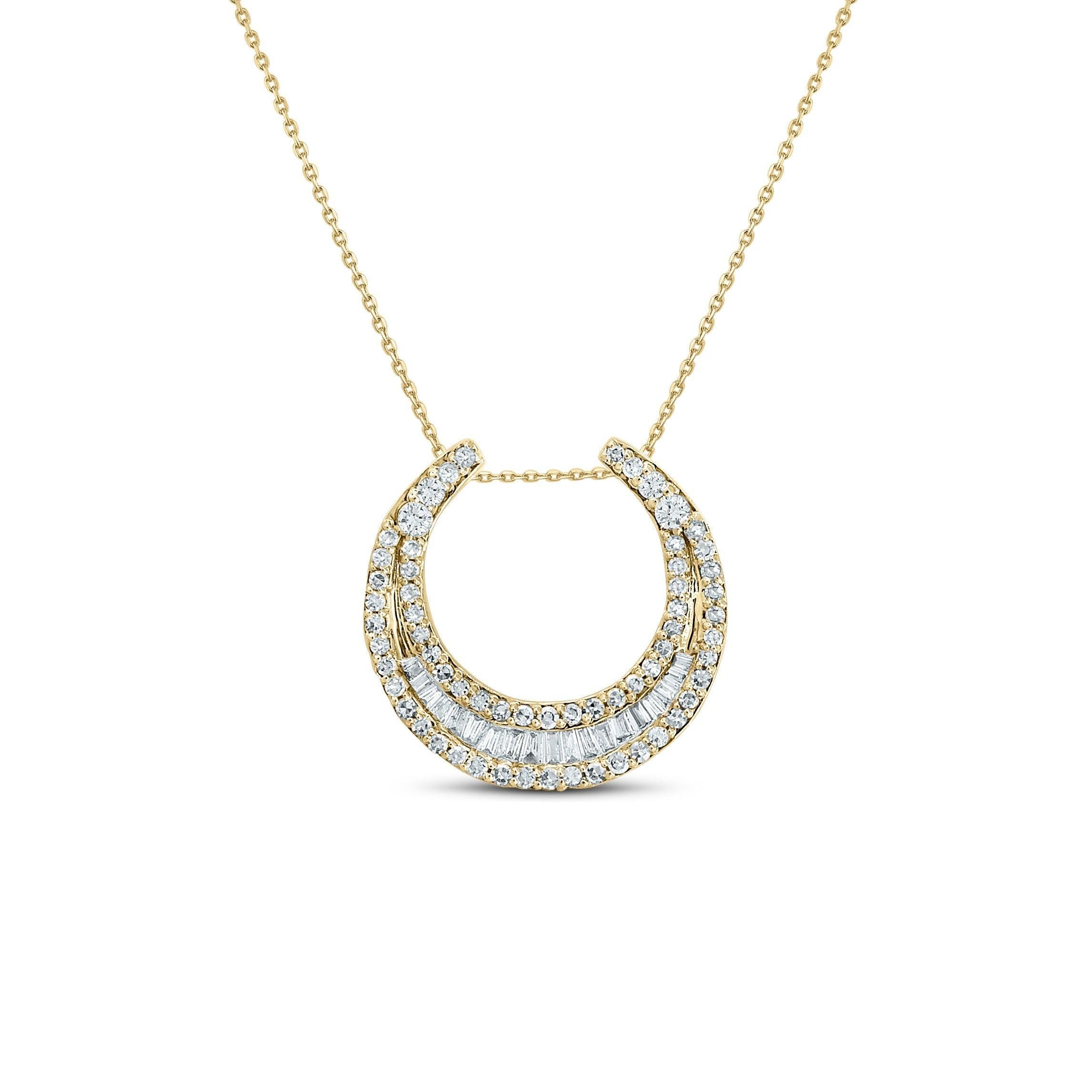 diamond moon shaped necklace in yellow gold with round and baguette diamonds on white background