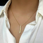 14k yellow gold engravable 3d vertical bar necklace with a single diamond