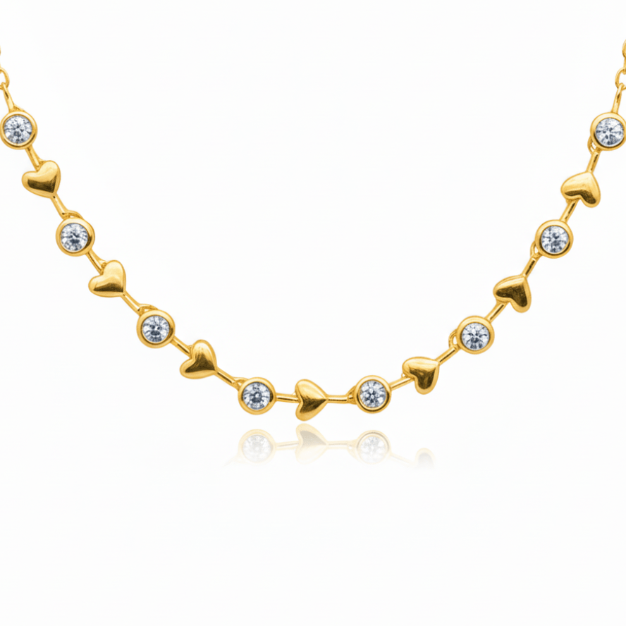 alternating diamond bezels and gold hearts design going 3/4 of the way around in an adjustable necklace in yellow gold