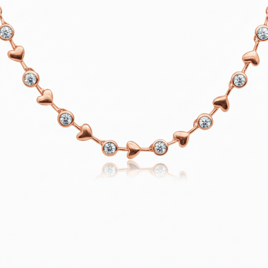 alternating diamond bezels and gold hearts design going 3/4 of the way around in an adjustable necklace in rose gold