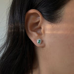 Load image into Gallery viewer, Emerald studs with double diamond halo with round and baguette diamonds in 14k yellow gold
