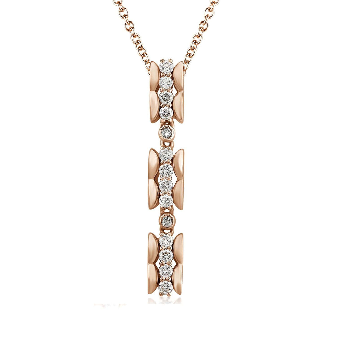 scalloped texture long vertical pendant with diamonds in 14k rose gold