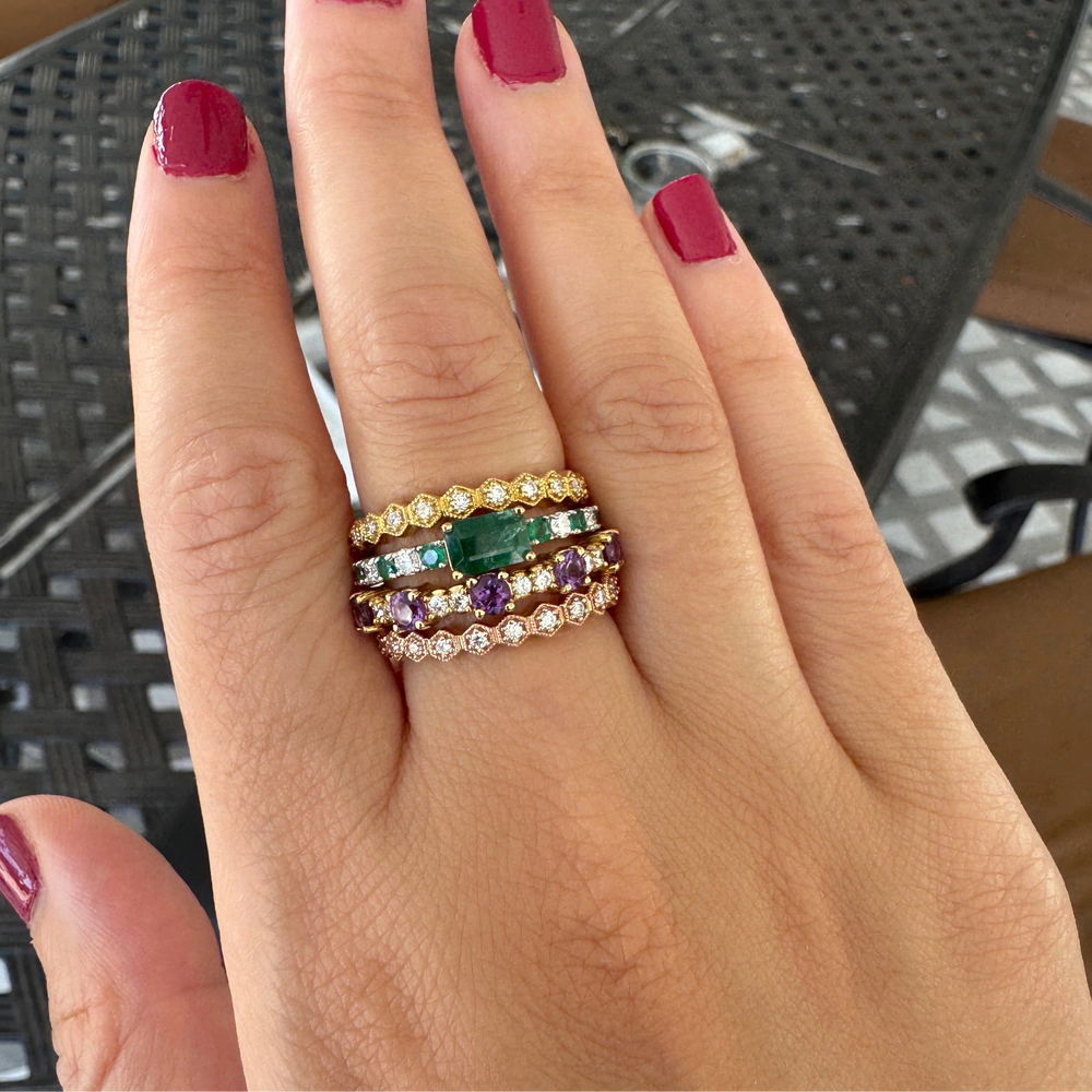 honeycomb diamond rings stacked with emerald and diamond rings and amethyst and diamond ring
