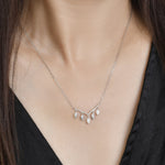 Load image into Gallery viewer, Marquise Diamond Cluster Dangling Pendant in 14k white gold on model
