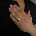 mens diamond band ring in 14k yellow gold. The diamonds are on the edge of the ring going half way around.