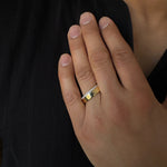 mens diamond band ring in 14k yellow gold. The diamonds are on the edge of the ring going half way around.