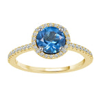 Load image into Gallery viewer, Blue Topaz and diamond ring in 14k yellow gold. Round blue topaz with diamond halo and diamonds on shank
