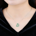 Load image into Gallery viewer, Emerald Initial D Pendant in Sterling Silver on model
