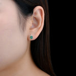 Load image into Gallery viewer, Emerald and White Zircon Studs in Sterling Silver on model
