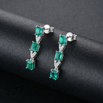 Load image into Gallery viewer, Three Stone Emerald and White Zircon Drop Earrings in Sterling Silver
