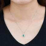 Load image into Gallery viewer, Pear Shape Emerald With White Zircon Pendant in Sterling Silver on model

