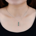 Load image into Gallery viewer, Round Emerald With White Zircon Drop Pendant in Sterling Silver on model
