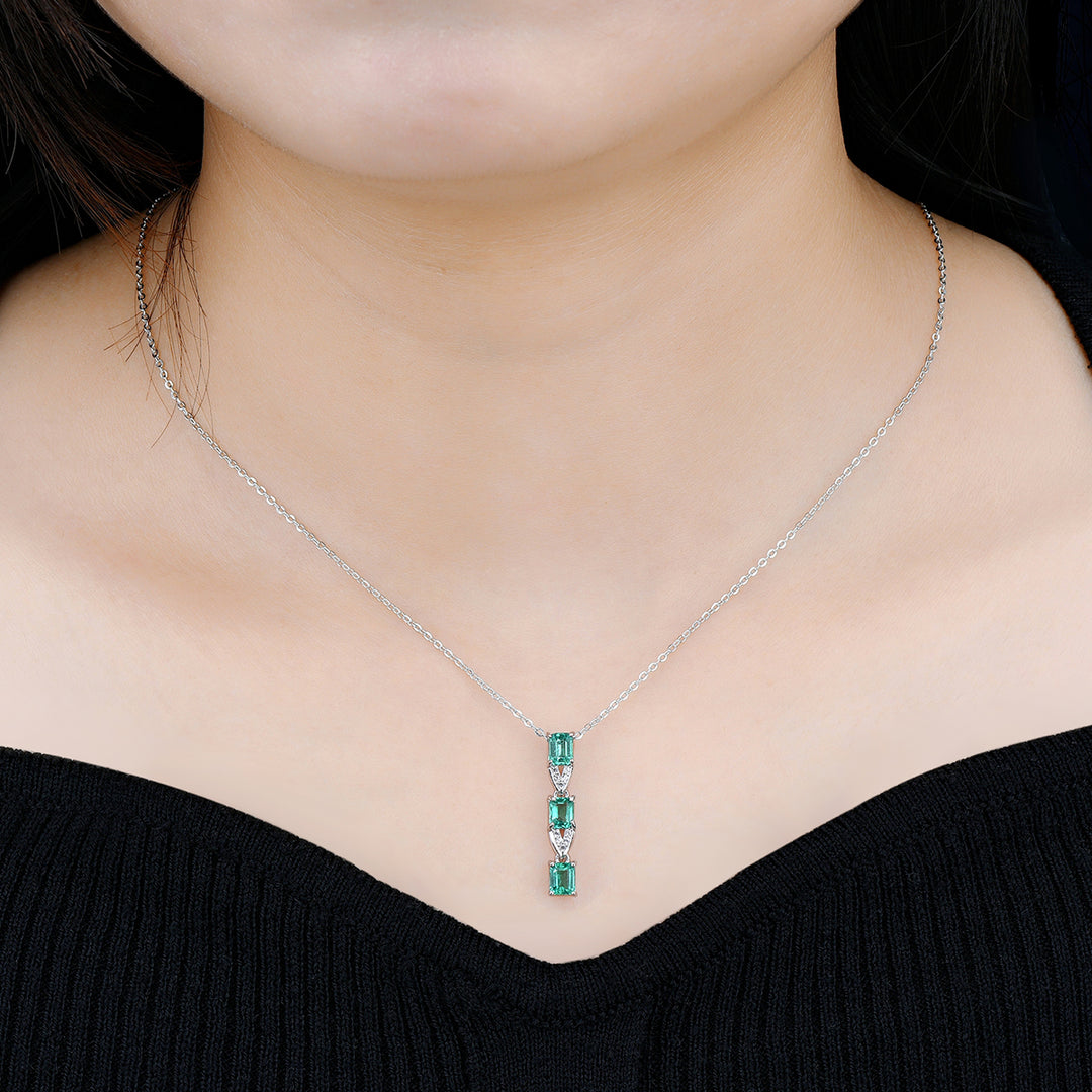 Three Stone Emerald and White Zircon Drop Pendant in Sterling Silver on model