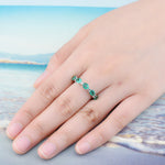 Load image into Gallery viewer, Oval Emerald Half Eternity Ring in Sterling Silver on model
