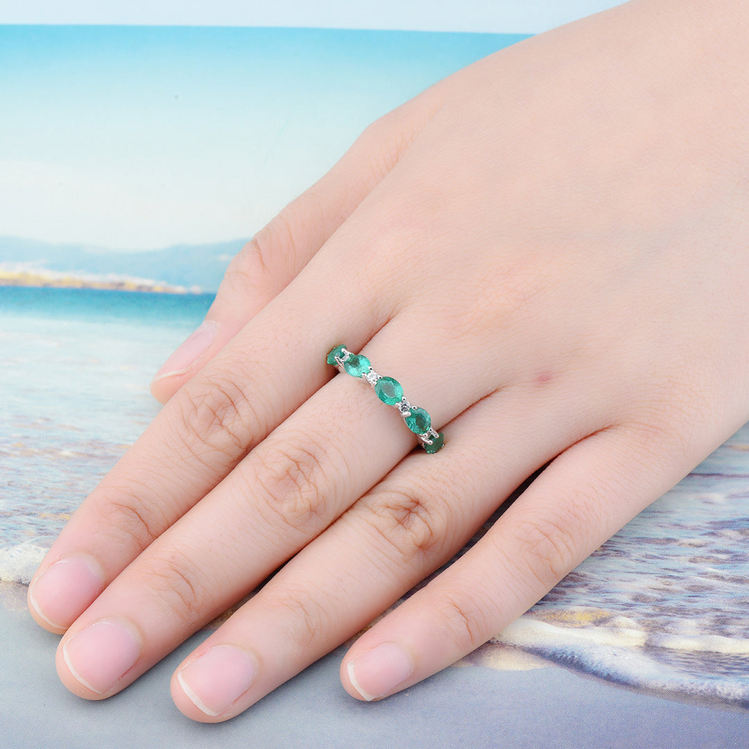 Oval Emerald Half Eternity Ring in Sterling Silver on model