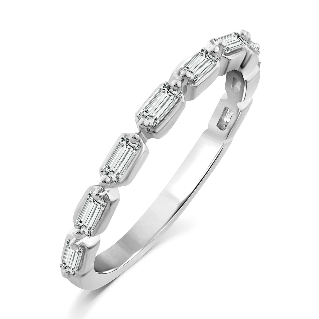 white gold diamond band ring with sideways baguette diamonds set between two prongs going half way eternity