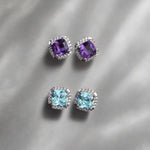 Load image into Gallery viewer, cushion cut amethyst and cushion cut blue topaz with diamond halo stud earrings