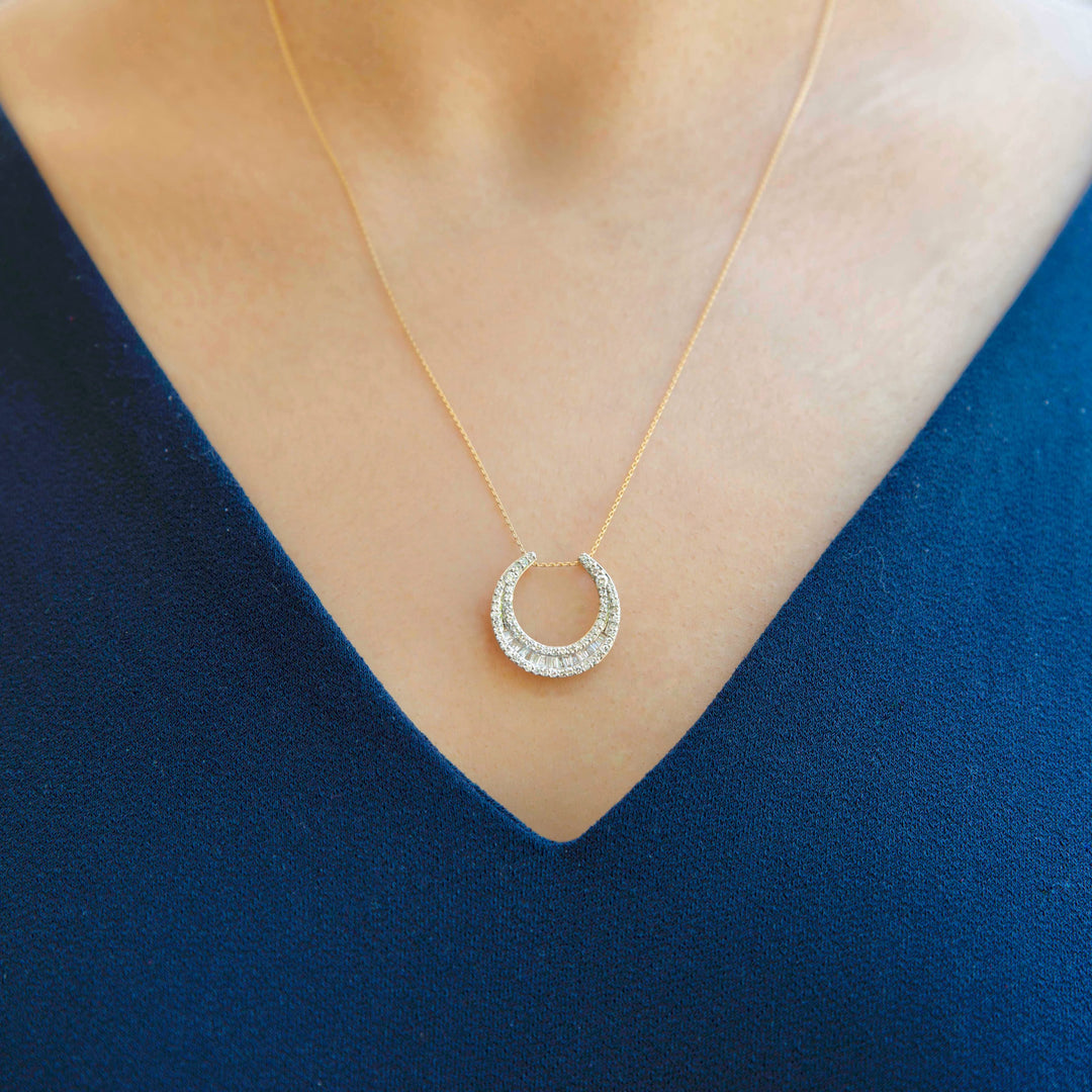 diamond moon shaped pendant in yellow gold with round and baguette diamond and adjustable chain for layering necklace