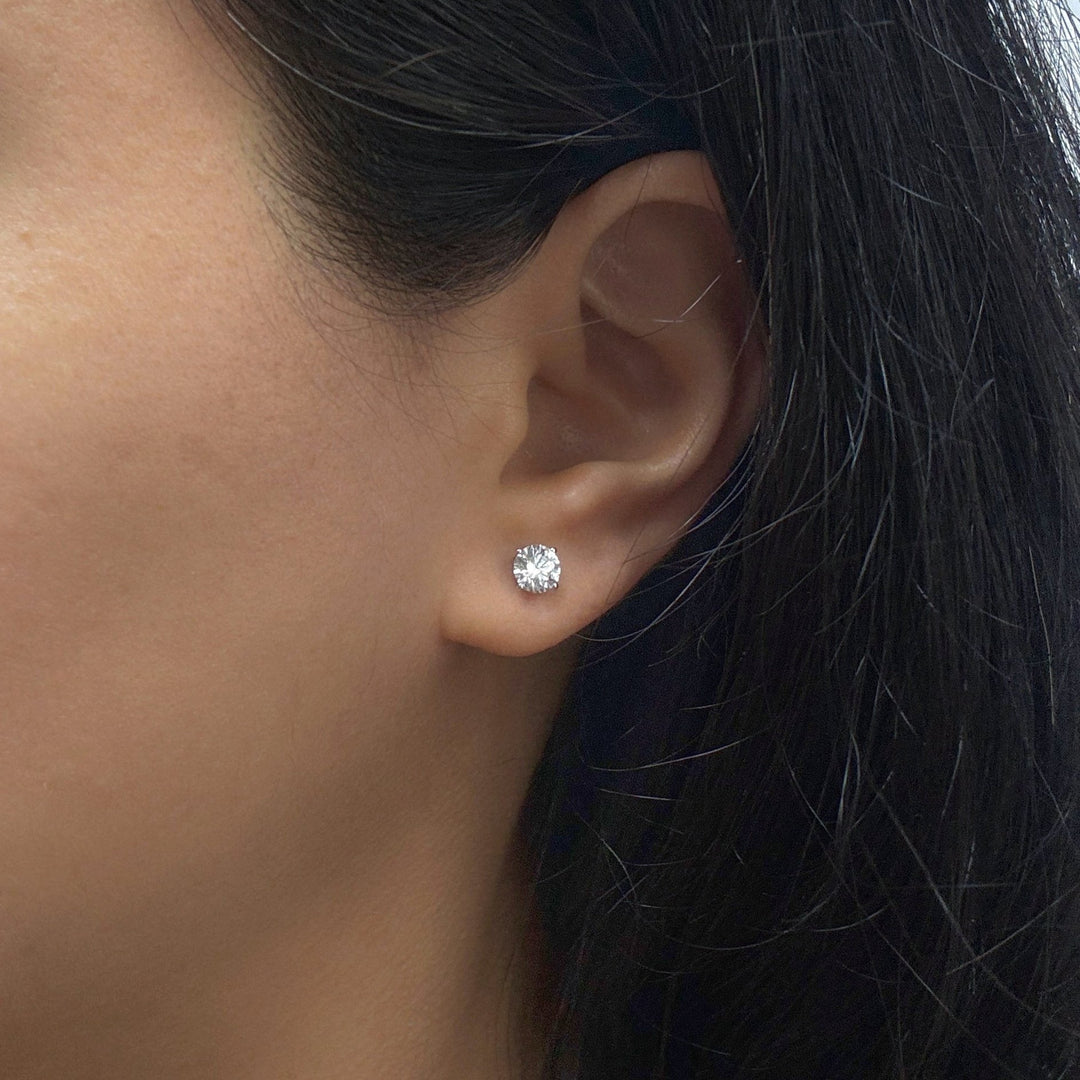 1ct diamond studs on a model