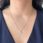 Load image into Gallery viewer, Diamond Evil Eye Pendant in 14k white gold on model

