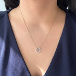 Load image into Gallery viewer, Diamond Baguette and Round Spiral Fashion Pendant in 14k yellow gold on model
