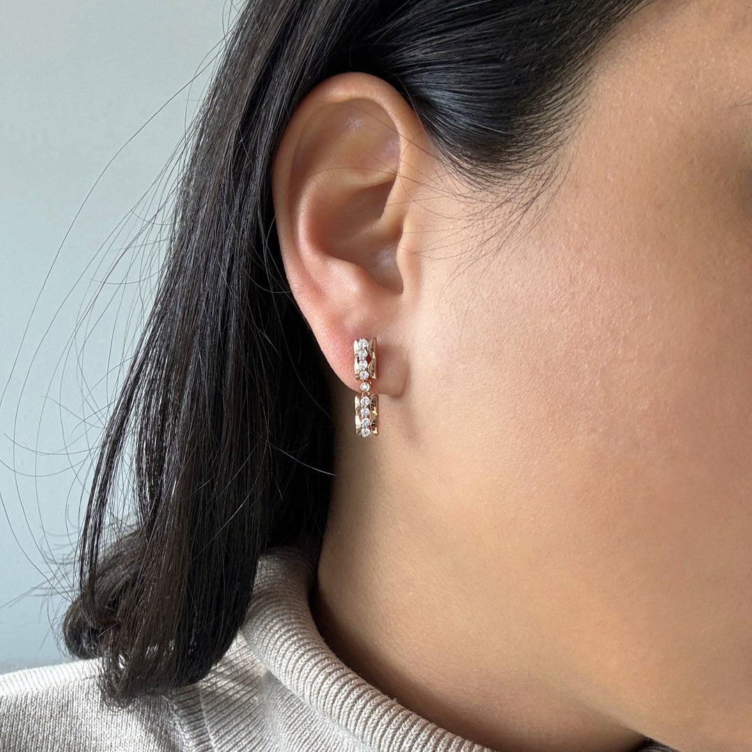 Scalloped textured mini dangle earrings with diamonds in 14k rose gold on model