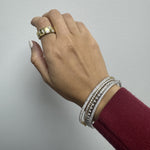 stackable bangles that are silver and cz bangles with a bold wide band ring