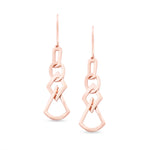 Load image into Gallery viewer, unique jewelry, unique earrings, fashion jewelry, fashion earrings, drop earrings in rose gold, dangling earrings, dangling drop earrings with a design of geometric shapes intertwined with each other. Earrings have a fishhook back. Earrings on model.