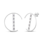 unique jewelry, unique earrings, fashion jewelry, fashion earrings, diamond earrings in white gold, fashion stud earrings, half circle motif earrings with a bar going through the circle. Bar has 5 diamonds.