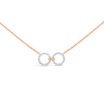 unique jewelry, unique necklace, fashion jewelry, fashion necklace, diamond necklace in rose gold, two circle shaped diamond motifs hanging horizontally connected in the middle by gold bar. Perfect for layering necklace.