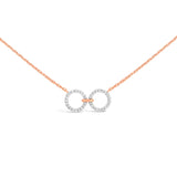 unique jewelry, unique necklace, fashion jewelry, fashion necklace, diamond necklace in rose gold, two circle shaped diamond motifs hanging horizontally connected in the middle by gold bar. Perfect for layering necklace.