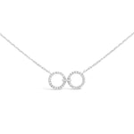 Load image into Gallery viewer, unique jewelry, unique necklace, fashion jewelry, fashion necklace, diamond necklace in white gold, two circle shaped diamond motifs hanging horizontally connected in the middle by gold bar. Perfect for layering necklace. Necklace is being worn by model.