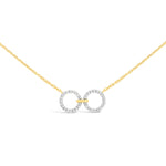 Load image into Gallery viewer, unique jewelry, unique necklace, fashion jewelry, fashion necklace, diamond necklace in yellow gold, two circle shaped diamond motifs hanging horizontally connected in the middle by gold bar. Perfect for layering necklace. Necklace is being worn by model.