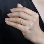 14k yellow gold open diamond ring with a circle and diamond motif on model