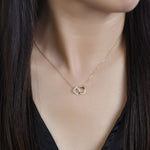 Load image into Gallery viewer, 14k yellow gold necklace with diamonds in a connected diamond motif and cirlce motif on model
