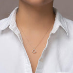 Load image into Gallery viewer, unique jewelry, unique pendant, fashion jewelry, fashion pendant, fashion necklace, diamond pendant in yellow gold, diamond necklace, fan shaped motif necklace with cable chain in 18in adjustable to 16in, layering necklace. Pendant on model.
