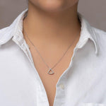 Load image into Gallery viewer, unique jewelry, unique pendant, fashion jewelry, fashion pendant, fashion necklace, diamond pendant in white gold, diamond necklace, fan shaped motif necklace with cable chain in 18in adjustable to 16in, layering necklace. Necklace on model.
